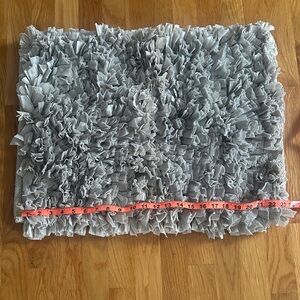 Bathroom rug in light grayish/taupe in color